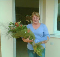 Delivering a bouquet of flowers and a box of chocolates in Aradipou Cyprus